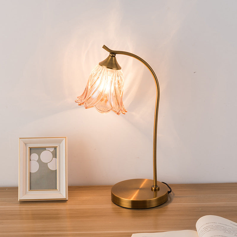 Modern Art Deco Round Flower Metal Glass Table Lamp - 1-Light for Bedroom

Enhance your bedroom decor with this stunning modern Art Deco table lamp. Featuring a round flower-shaped design, crafted from durable metal and glass, it offers both style and fun