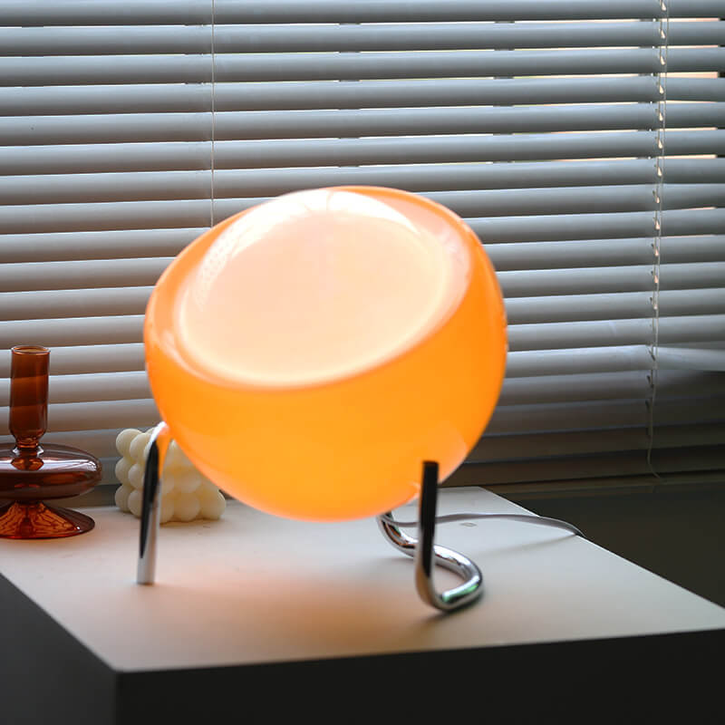 Contemporary Nordic Planet Orange Glass Iron 1-Light Table Lamp 

Enhance your bedroom decor with this modern Nordic-inspired table lamp. Featuring a striking orange glass shade and durable iron base, this 1-light lamp offers both style and functionality.