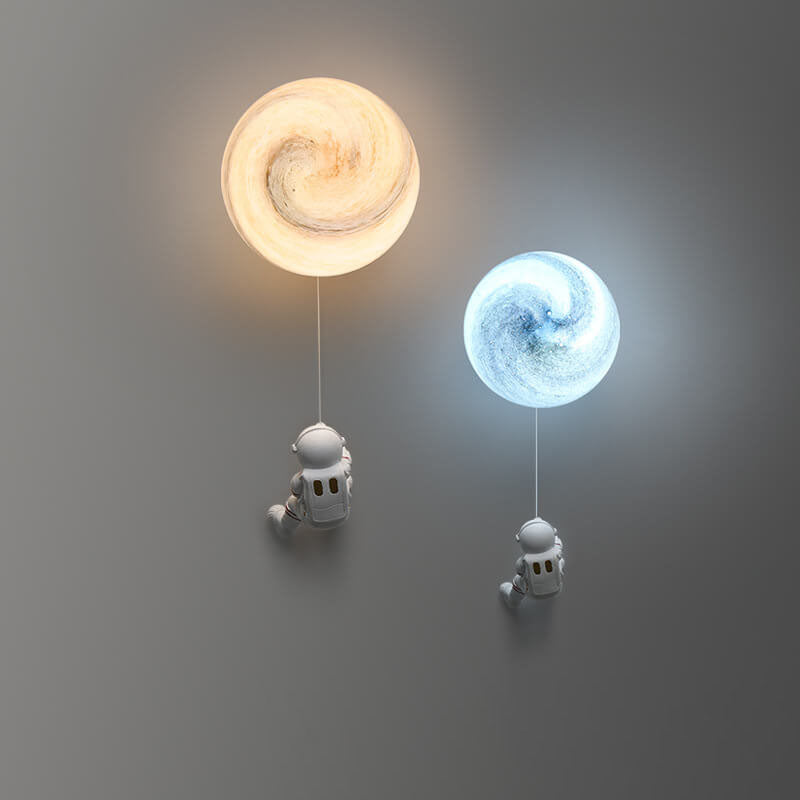 Contemporary Orb Astronaut Wall Sconce - Iron Resin 1-Light Lamp for Bedroom

Illuminate your space with the contemporary Orb Astronaut Wall Sconce, designed to bring a modern touch to your bedroom. This unique 1-light lamp features an elegant orb shape c