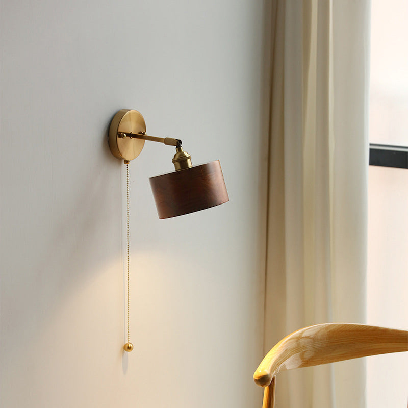 Contemporary Scandinavian Copper Wood 1-Light Wall Sconce for Bedroom  

Illuminate your bedroom with this stylish Scandinavian-inspired wall sconce. The unique round cone design combines warm copper and natural wood for a modern touch. This 1-light fixtu