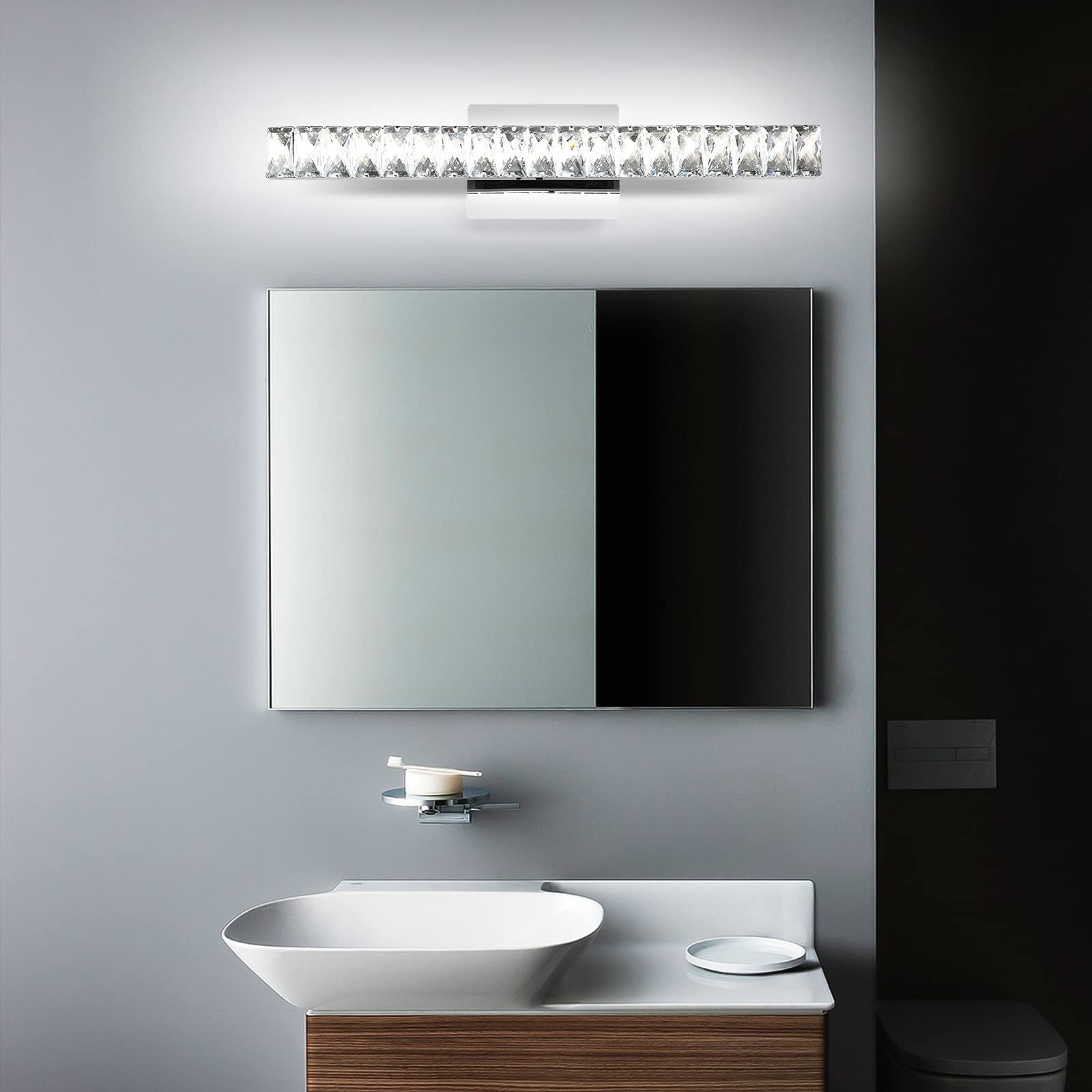 Modern Luxury Stainless Steel Crystal LED Wall Sconce Vanity Light  

Transform your bathroom with this elegant wall sconce featuring a sleek stainless steel design adorned with crystals. The rotatable feature allows for adjustable lighting, enhancing any