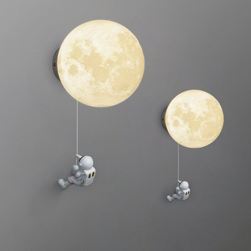 Contemporary Orb Astronaut Wall Sconce - Iron Resin 1-Light Lamp for Bedroom

Illuminate your space with the contemporary Orb Astronaut Wall Sconce, designed to bring a modern touch to your bedroom. This unique 1-light lamp features an elegant orb shape c