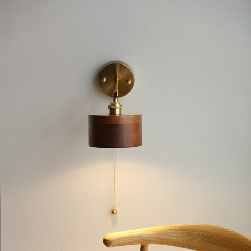 Contemporary Scandinavian Copper Wood 1-Light Wall Sconce for Bedroom  

Illuminate your bedroom with this stylish Scandinavian-inspired wall sconce. The unique round cone design combines warm copper and natural wood for a modern touch. This 1-light fixtu