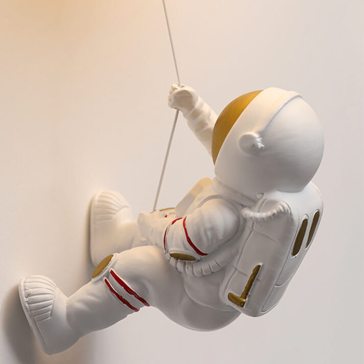 Contemporary Orb Astronaut Wall Sconce - Iron Resin 1-Light Lamp for Bedroom

Illuminate your space with the contemporary Orb Astronaut Wall Sconce, designed to bring a modern touch to your bedroom. This unique 1-light lamp features an elegant orb shape c