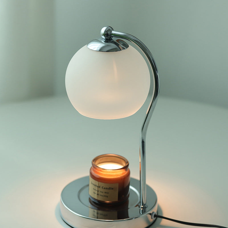 Modern Minimalist Orb Iron Glass Melting Wax Table Lamp - Bedroom Decor 

Illuminate your space with this stylish modern minimalist table lamp, featuring a unique orb design. Crafted from durable iron and elegant glass, the melting wax effect adds a conte