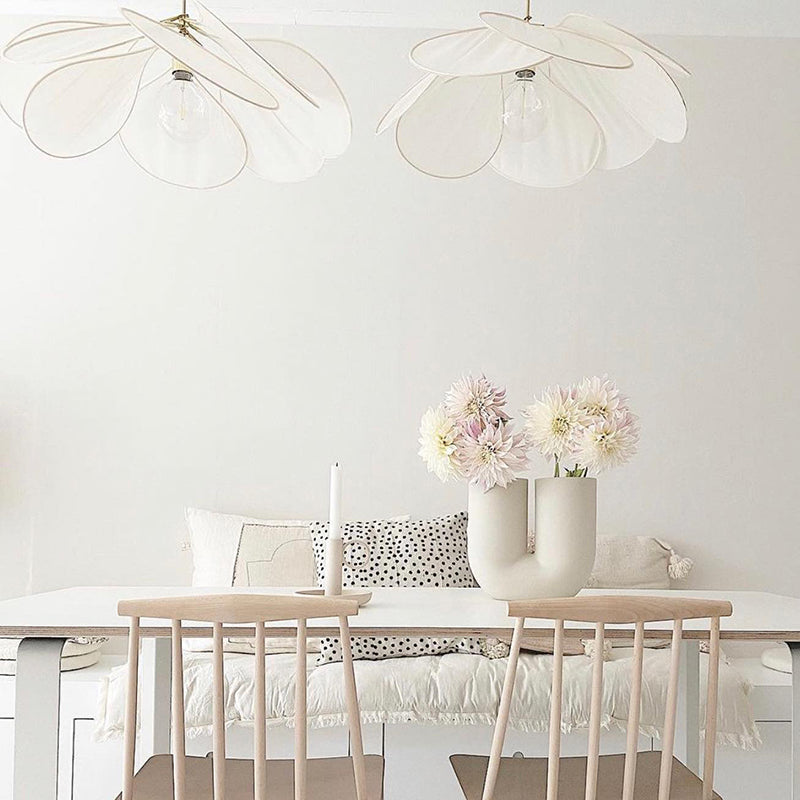 Contemporary Boho Metal Petal Pendant Light for Living Room  

Illuminate your living space with our Contemporary Boho Petal Fabric Metal Lampshade Pendant Light. This stylish 1-light fixture is perfect for adding a touch of bohemian flair to your decor.