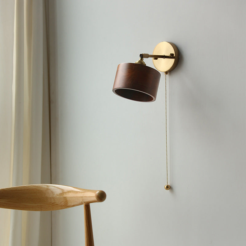 Contemporary Scandinavian Copper Wood 1-Light Wall Sconce for Bedroom  

Illuminate your bedroom with this stylish Scandinavian-inspired wall sconce. The unique round cone design combines warm copper and natural wood for a modern touch. This 1-light fixtu