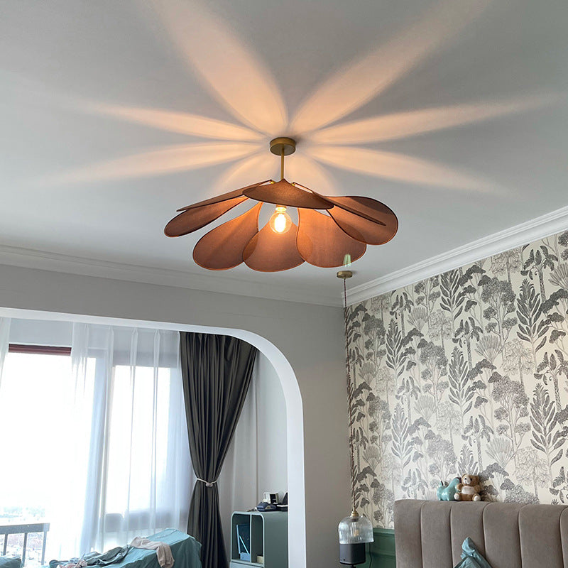 Contemporary Boho Metal Petal Pendant Light for Living Room  

Illuminate your living space with our Contemporary Boho Petal Fabric Metal Lampshade Pendant Light. This stylish 1-light fixture is perfect for adding a touch of bohemian flair to your decor.
