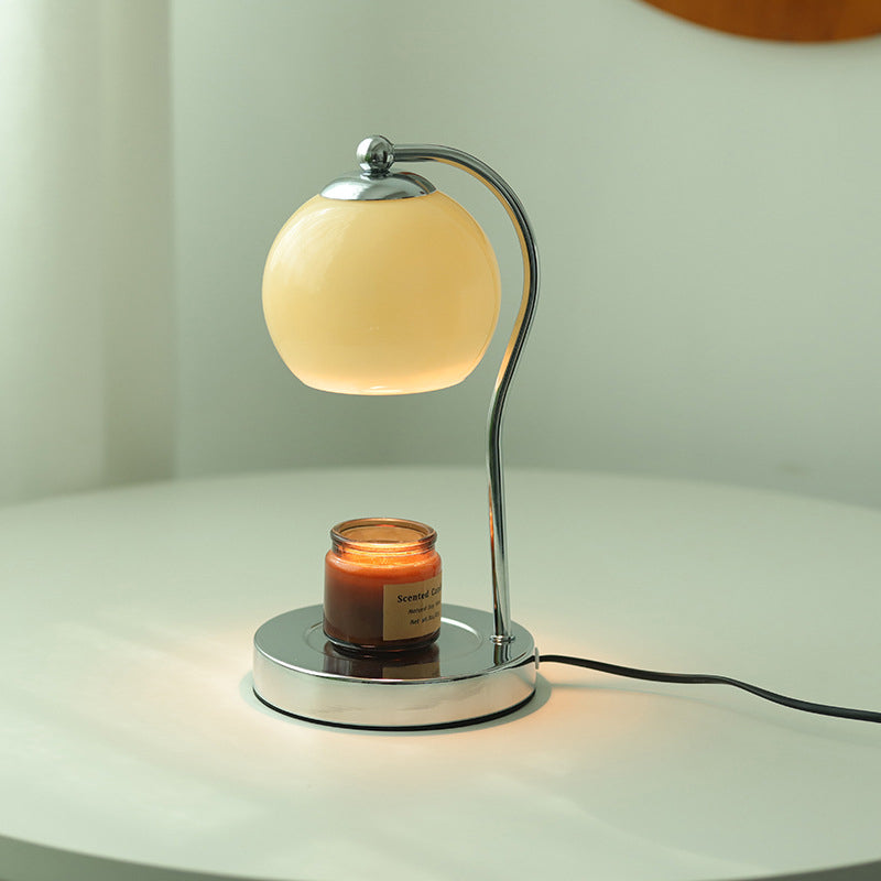 Modern Minimalist Orb Iron Glass Melting Wax Table Lamp - Bedroom Decor 

Illuminate your space with this stylish modern minimalist table lamp, featuring a unique orb design. Crafted from durable iron and elegant glass, the melting wax effect adds a conte
