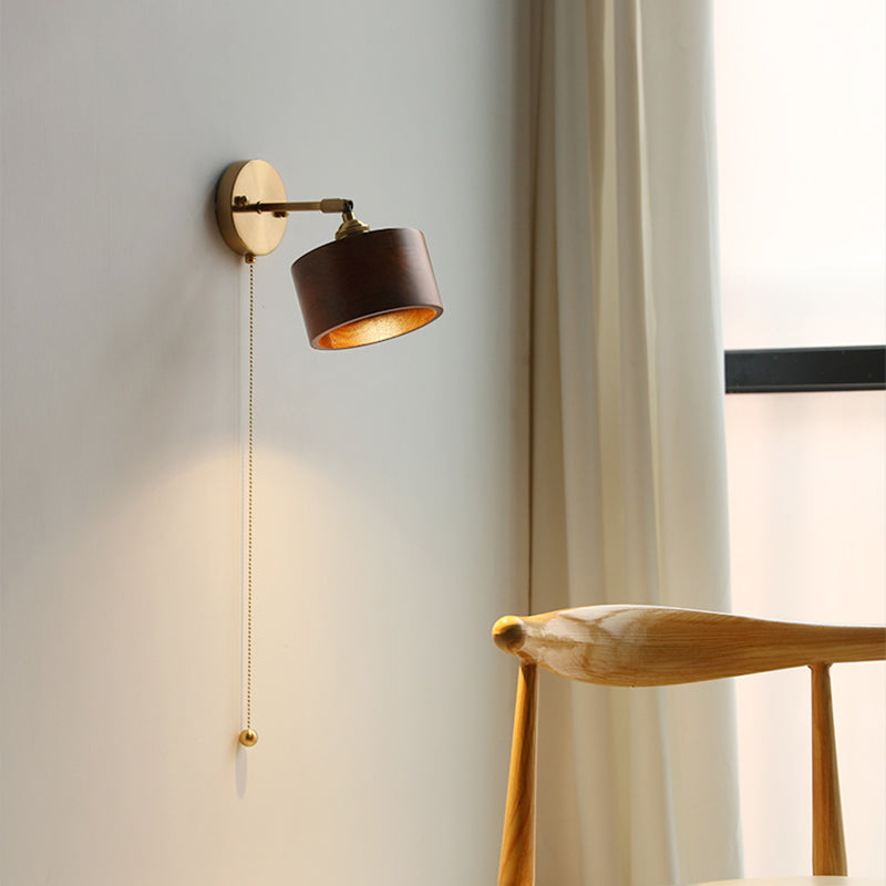 Contemporary Scandinavian Copper Wood 1-Light Wall Sconce for Bedroom  

Illuminate your bedroom with this stylish Scandinavian-inspired wall sconce. The unique round cone design combines warm copper and natural wood for a modern touch. This 1-light fixtu