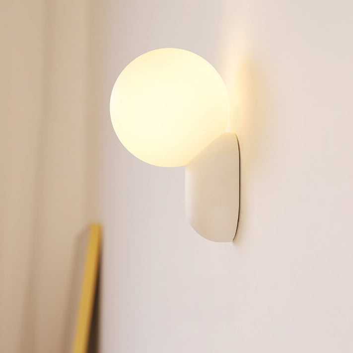 Macaron Cream Resin Glass Ball 1-Light Wall Sconce Lamp 

Illuminate your space with this stylish macaron cream wall sconce featuring a delightful resin glass ball design. Perfect for modern interiors, this 1-light lamp adds a touch of elegance to living