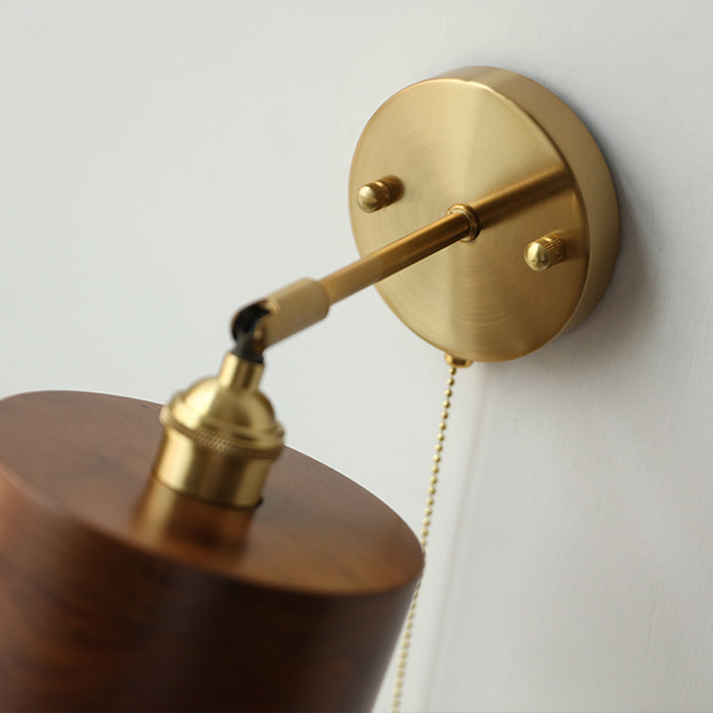 Contemporary Scandinavian Copper Wood 1-Light Wall Sconce for Bedroom  

Illuminate your bedroom with this stylish Scandinavian-inspired wall sconce. The unique round cone design combines warm copper and natural wood for a modern touch. This 1-light fixtu