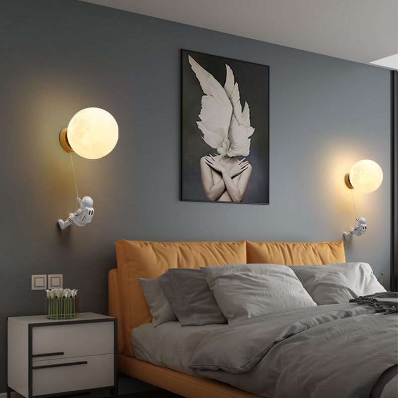 Contemporary Orb Astronaut Wall Sconce - Iron Resin 1-Light Lamp for Bedroom

Illuminate your space with the contemporary Orb Astronaut Wall Sconce, designed to bring a modern touch to your bedroom. This unique 1-light lamp features an elegant orb shape c