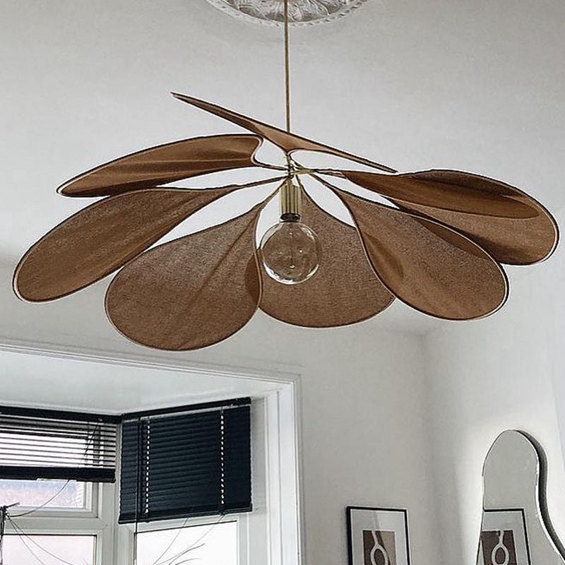 Contemporary Boho Metal Petal Pendant Light for Living Room  

Illuminate your living space with our Contemporary Boho Petal Fabric Metal Lampshade Pendant Light. This stylish 1-light fixture is perfect for adding a touch of bohemian flair to your decor.