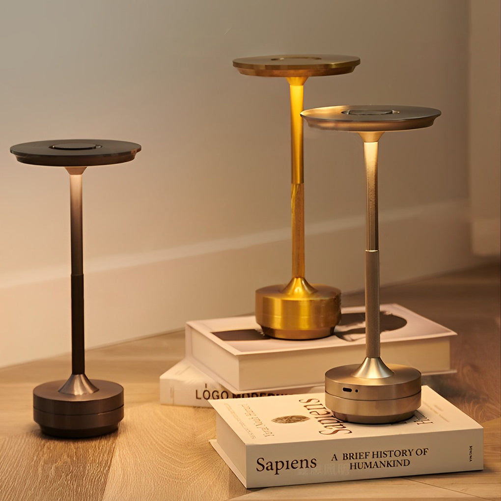 Title: Sleek Metal UFO Alien Table Lamp - Cordless & Modern

Description: Illuminate your space with our Slender Cordless UFO Alien Table Lamp. Featuring a stylish plated metal design, this futuristic lamp is perfect for adding a unique touch to any room.