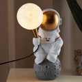 Contemporary Astronaut Resin Table Lamp - 1-Light ABS Design for Bedroom 

Illuminate your space with this unique contemporary astronaut table lamp. Crafted from high-quality resin and ABS materials, it features a striking design that adds a playful yet m