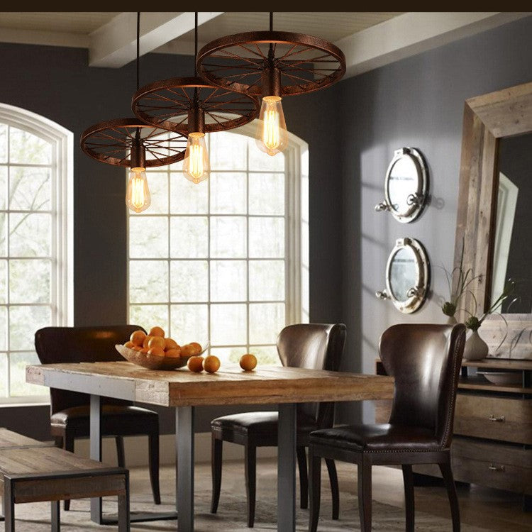 Industrial Wrought Iron Wheels Chandelier - 1/3/6 Light Vintage Lighting Fixture

Elevate your space with this stunning industrial chandelier featuring wrought iron wheels. Perfect for dining rooms, living areas, or entryways, this versatile fixture is av