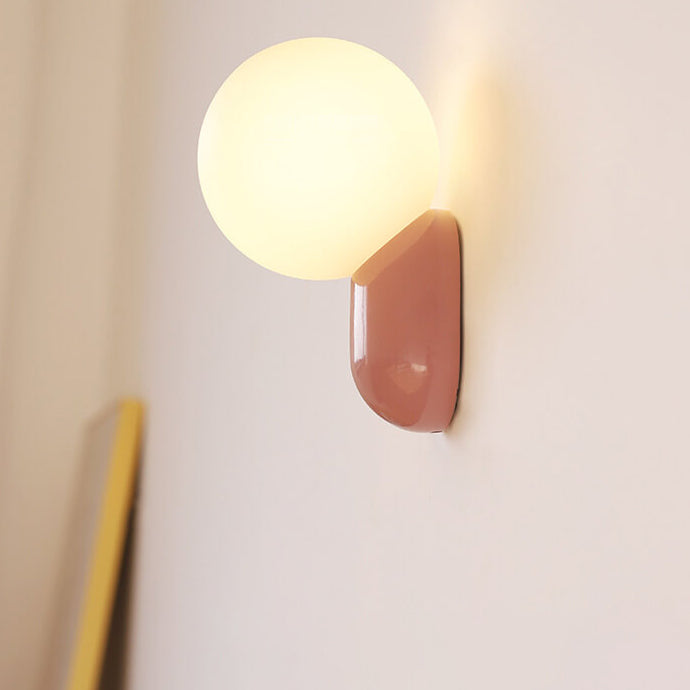 Macaron Cream Resin Glass Ball 1-Light Wall Sconce Lamp 

Illuminate your space with this stylish macaron cream wall sconce featuring a delightful resin glass ball design. Perfect for modern interiors, this 1-light lamp adds a touch of elegance to living