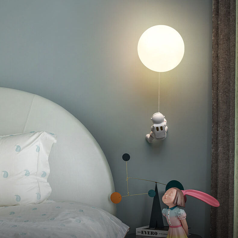 Contemporary Orb Astronaut Wall Sconce - Iron Resin 1-Light Lamp for Bedroom

Illuminate your space with the contemporary Orb Astronaut Wall Sconce, designed to bring a modern touch to your bedroom. This unique 1-light lamp features an elegant orb shape c
