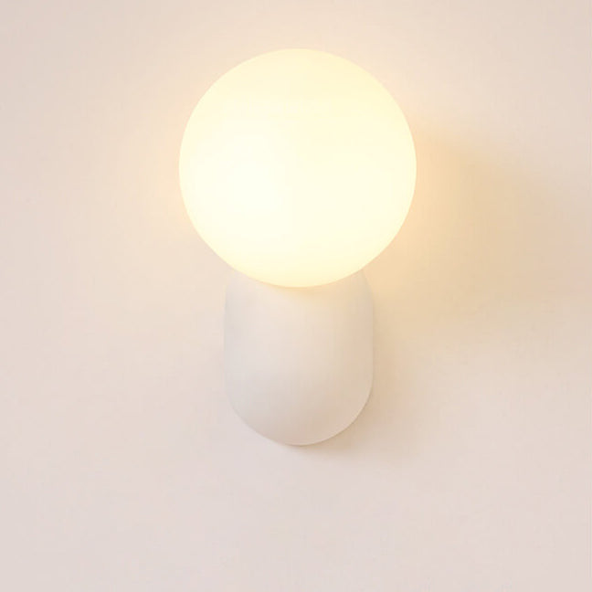 Macaron Cream Resin Glass Ball 1-Light Wall Sconce Lamp 

Illuminate your space with this stylish macaron cream wall sconce featuring a delightful resin glass ball design. Perfect for modern interiors, this 1-light lamp adds a touch of elegance to living