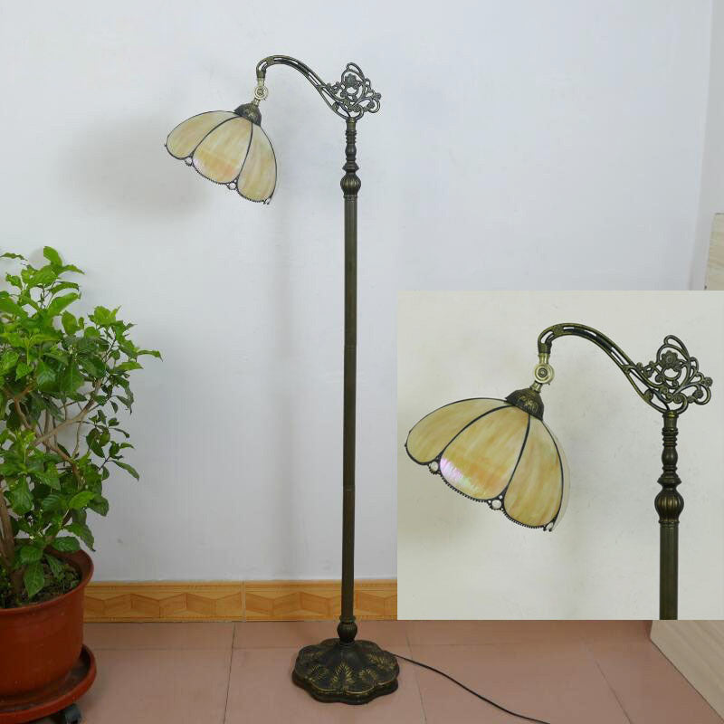 Tiffany Stained Glass Petal Shade Floor Lamp for Home Office  

Illuminate your home office with this stunning Tiffany stained glass petal shade floor lamp. Featuring exquisite craftsmanship and a classic design, this 1-light standing lamp combines beauty