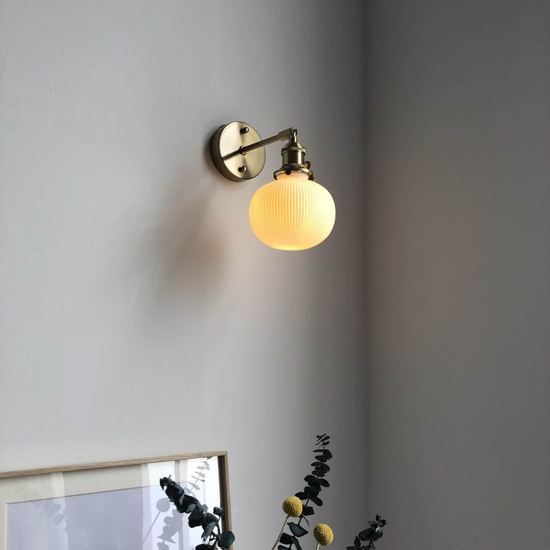 Japanese Retro Minimalist Brass Lucite Wall Sconce Lamp - 1-Light Oval Design