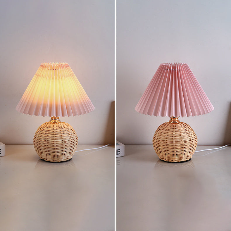 Contemporary Nordic Rattan Pleated LED Table Lamp for Bedroom 

Enhance your bedroom decor with this stylish contemporary Nordic rattan fabric table lamp. Featuring a unique pleated conic design, this LED lamp offers a warm, inviting glow while showcasing
