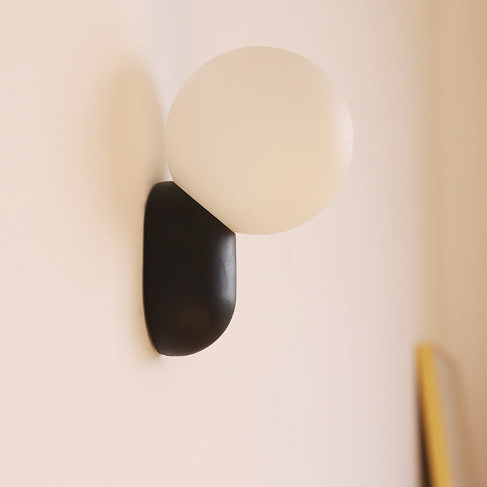 Macaron Cream Resin Glass Ball 1-Light Wall Sconce Lamp 

Illuminate your space with this stylish macaron cream wall sconce featuring a delightful resin glass ball design. Perfect for modern interiors, this 1-light lamp adds a touch of elegance to living