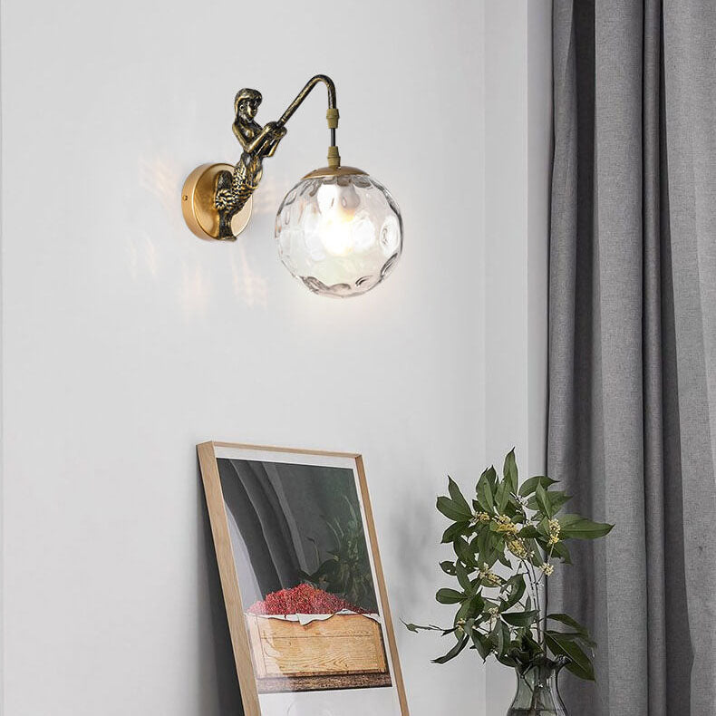 Vintage Rustic Mermaid Wall Sconce Lamp - 1-Light Decor for Coastal Home  

Illuminate your space with this enchanting Vintage Rustic Mermaid Orb 1-Light Wall Sconce Lamp. Perfect for coastal-themed decor, this wall sconce features a charming mermaid desi