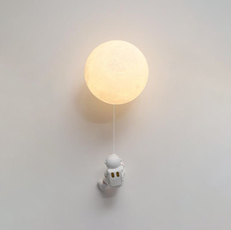 Contemporary Orb Astronaut Wall Sconce - Iron Resin 1-Light Lamp for Bedroom

Illuminate your space with the contemporary Orb Astronaut Wall Sconce, designed to bring a modern touch to your bedroom. This unique 1-light lamp features an elegant orb shape c