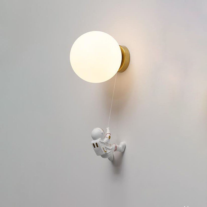 Contemporary Orb Astronaut Wall Sconce - Iron Resin 1-Light Lamp for Bedroom

Illuminate your space with the contemporary Orb Astronaut Wall Sconce, designed to bring a modern touch to your bedroom. This unique 1-light lamp features an elegant orb shape c