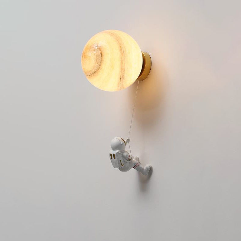 Contemporary Orb Astronaut Wall Sconce - Iron Resin 1-Light Lamp for Bedroom

Illuminate your space with the contemporary Orb Astronaut Wall Sconce, designed to bring a modern touch to your bedroom. This unique 1-light lamp features an elegant orb shape c