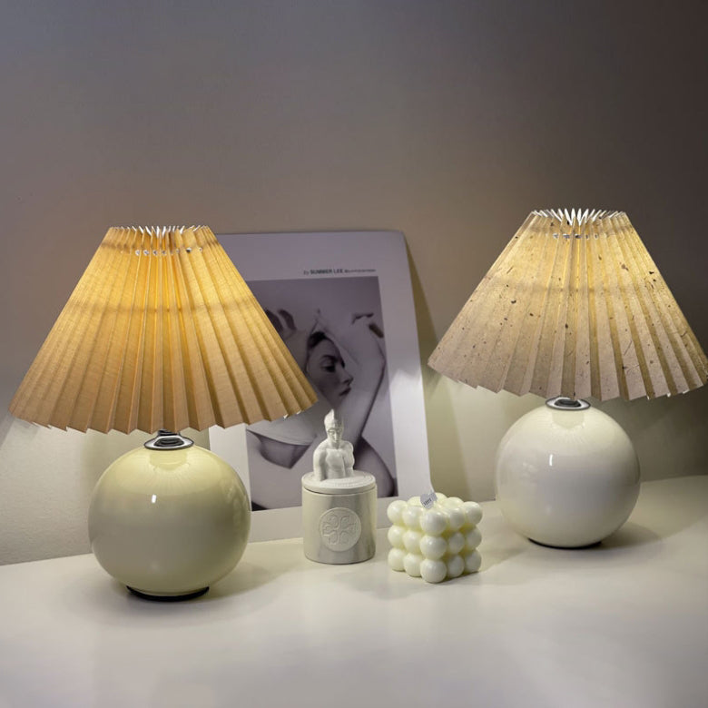 Modern Minimalist Round Fabric Pleated Ceramic 1-Light Table Lamp for Bedroom | Stylish Bedside Lighting | Contemporary Home Decor | Elegant Bedroom Accent | Soft Ambient Illumination | Decorative Lighting Fixture | Chic Fabric Shade | Ceramic Base Design