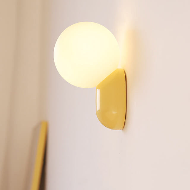 Macaron Cream Resin Glass Ball 1-Light Wall Sconce Lamp 

Illuminate your space with this stylish macaron cream wall sconce featuring a delightful resin glass ball design. Perfect for modern interiors, this 1-light lamp adds a touch of elegance to living
