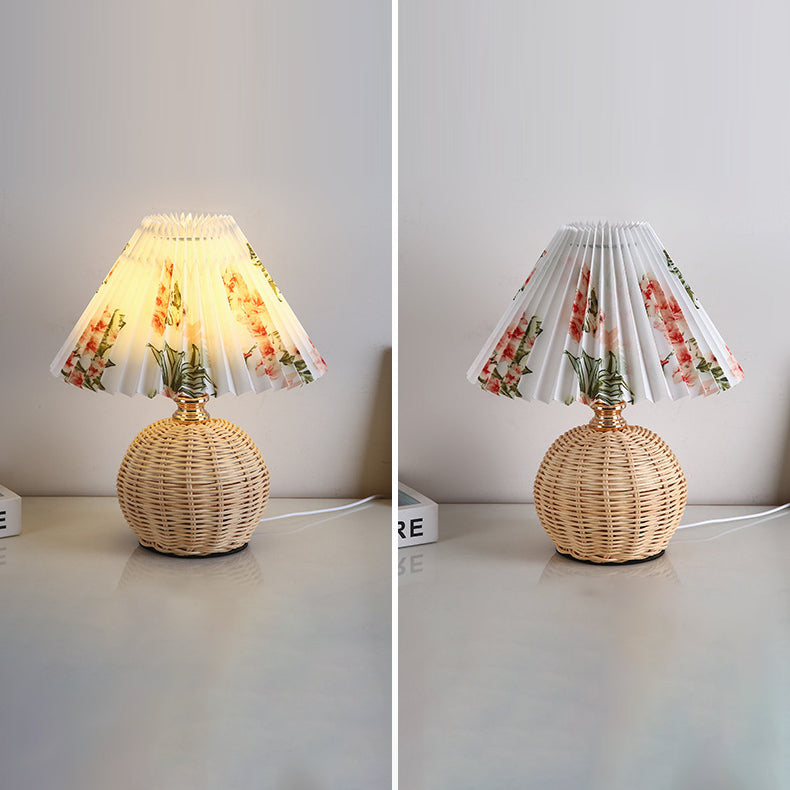 Contemporary Nordic Rattan Pleated LED Table Lamp for Bedroom 

Enhance your bedroom decor with this stylish contemporary Nordic rattan fabric table lamp. Featuring a unique pleated conic design, this LED lamp offers a warm, inviting glow while showcasing