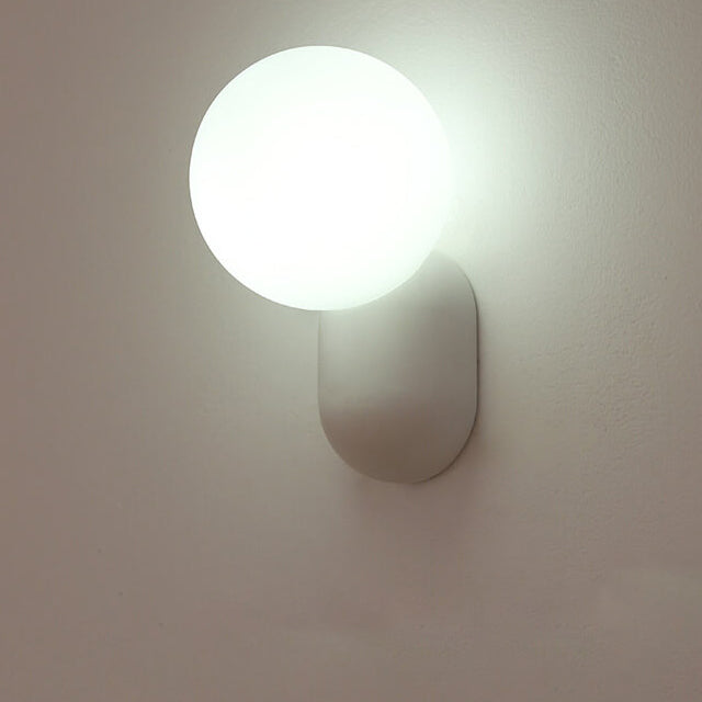 Macaron Cream Resin Glass Ball 1-Light Wall Sconce Lamp 

Illuminate your space with this stylish macaron cream wall sconce featuring a delightful resin glass ball design. Perfect for modern interiors, this 1-light lamp adds a touch of elegance to living