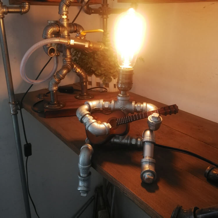 Industrial Plumbing Guitar Robot 1-Light Table Lamp | Unique LED Lighting | Modern Industrial Home Decor | Music-Themed Desk Lamp | Vintage Style Guitar Design | Creative Lighting Solution | Industrial Pipe Lamp | Adjustable Guitar Stand Base | Decorative
