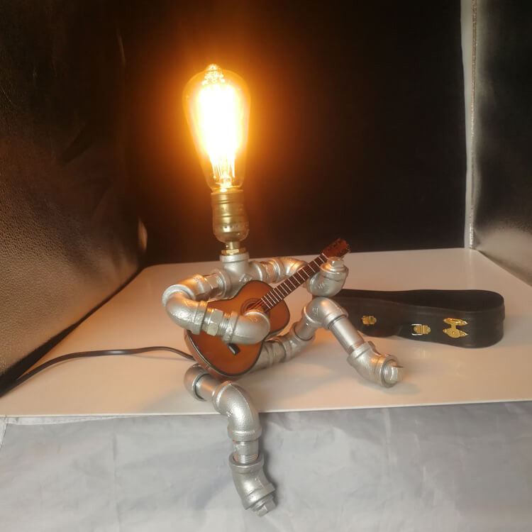 Industrial Plumbing Guitar Robot 1-Light Table Lamp | Unique LED Lighting | Modern Industrial Home Decor | Music-Themed Desk Lamp | Vintage Style Guitar Design | Creative Lighting Solution | Industrial Pipe Lamp | Adjustable Guitar Stand Base | Decorative
