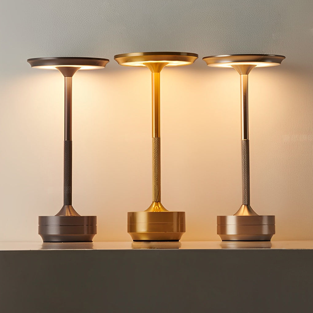 Title: Sleek Metal UFO Alien Table Lamp - Cordless & Modern

Description: Illuminate your space with our Slender Cordless UFO Alien Table Lamp. Featuring a stylish plated metal design, this futuristic lamp is perfect for adding a unique touch to any room.