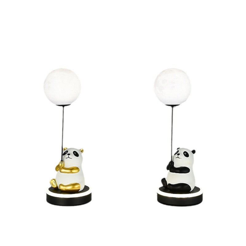 Contemporary Panda PVC Lampshade LED Table Lamp for Bedroom

Illuminate your space with our Contemporary Panda Resin Base PVC Lampshade LED Table Lamp, perfect for adding a touch of whimsy and charm to your bedroom decor. Crafted with high-quality materia
