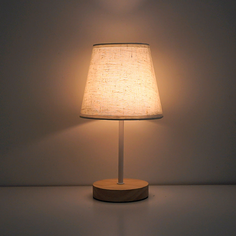 Modern Minimalist Trapezoidal Solid Wood Fabric LED Bedroom Lamp