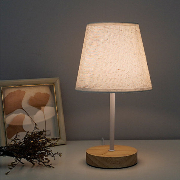 Modern Minimalist Trapezoidal Solid Wood Fabric LED Table Lamp for Bedroom, Contemporary Nightstand Light, Stylish Home Decor, Warm White Lighting, Eco-Friendly Design, Adjustable Brightness, Bedroom Lighting, Scandinavian Style Lamp, Chic Bedroom Accesso