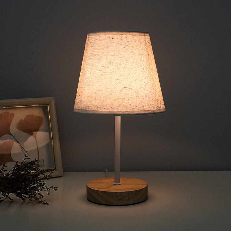 Modern Minimalist Trapezoidal Solid Wood Fabric LED Bedroom Lamp