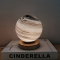 Contemporary Globe Wood Glass LED Table Lamp for Living Room  

Illuminate your living space with our stylish Contemporary Globe Wood Glass LED Table Lamp. This modern design features a chic globe shape, combining natural wood and sleek glass for a perfec