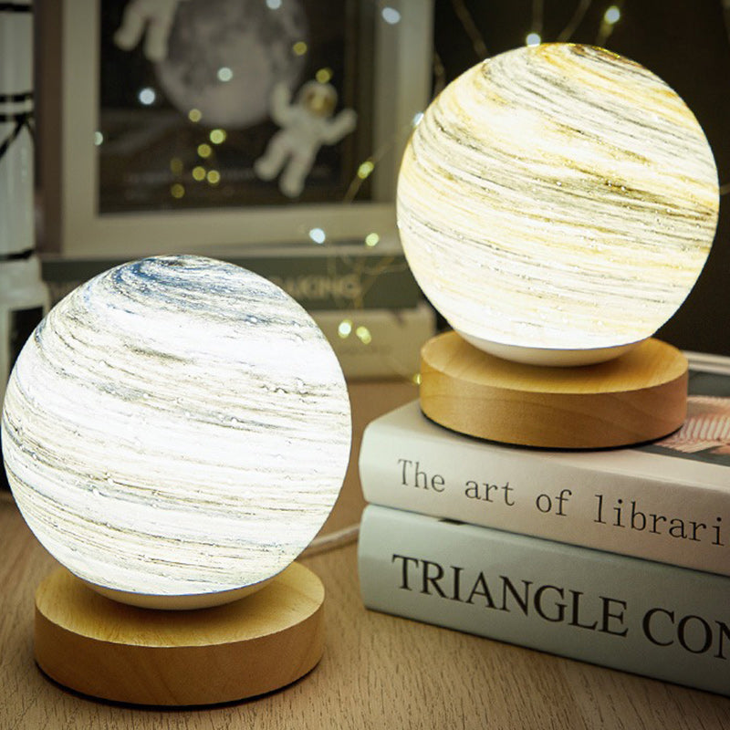 Contemporary Globe Wood Glass LED Table Lamp for Living Room  

Illuminate your living space with our stylish Contemporary Globe Wood Glass LED Table Lamp. This modern design features a chic globe shape, combining natural wood and sleek glass for a perfec