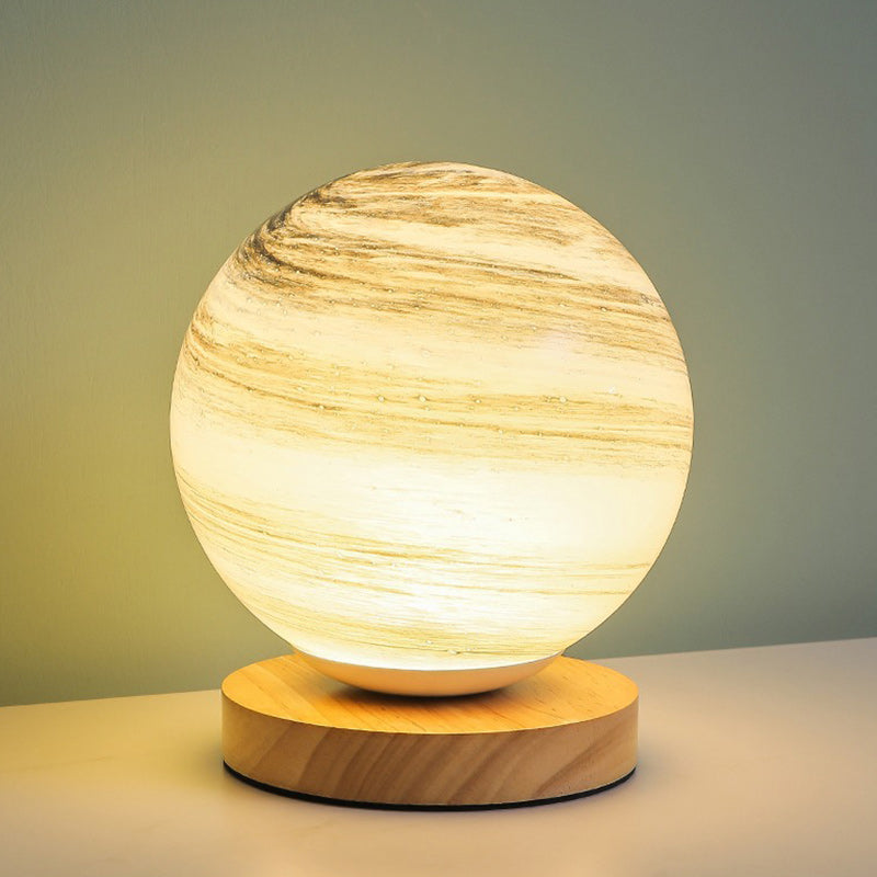 Contemporary Globe Wood Glass LED Table Lamp for Living Room  

Illuminate your living space with our stylish Contemporary Globe Wood Glass LED Table Lamp. This modern design features a chic globe shape, combining natural wood and sleek glass for a perfec