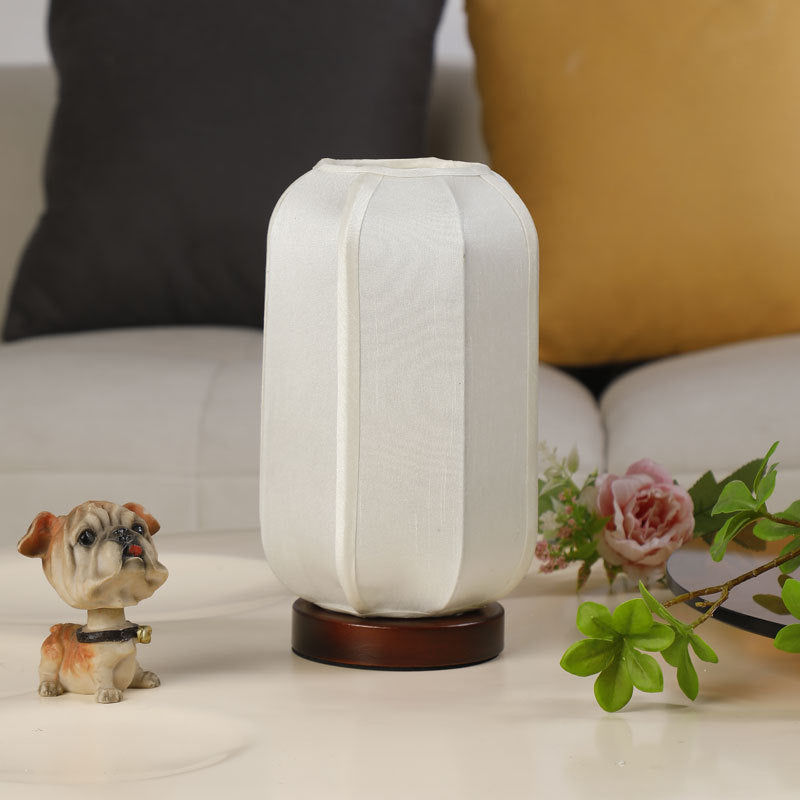 Traditional Chinese Fabric Cylinder Shade Table Lamp - 1-Light Wood Base for Bedroom 

Illuminate your space with this elegant Traditional Chinese table lamp. Featuring a unique fabric cylinder shade, it adds a touch of cultural charm to any bedroom. The