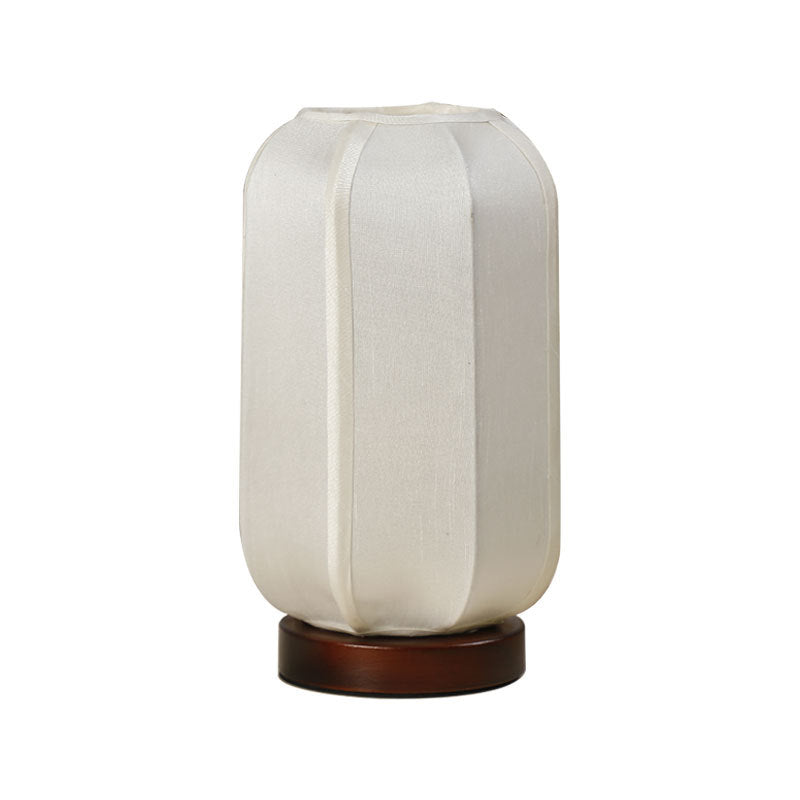 Traditional Chinese Fabric Cylinder Shade Table Lamp - 1-Light Wood Base for Bedroom 

Illuminate your space with this elegant Traditional Chinese table lamp. Featuring a unique fabric cylinder shade, it adds a touch of cultural charm to any bedroom. The