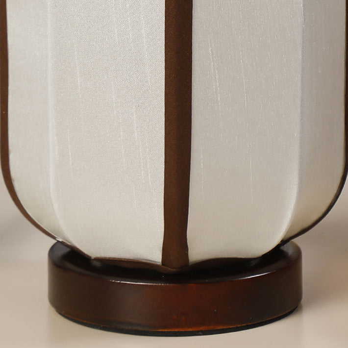 Traditional Chinese Fabric Cylinder Shade Table Lamp - 1-Light Wood Base for Bedroom 

Illuminate your space with this elegant Traditional Chinese table lamp. Featuring a unique fabric cylinder shade, it adds a touch of cultural charm to any bedroom. The