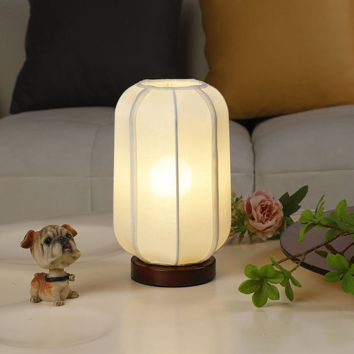 Traditional Chinese Fabric Cylinder Shade Table Lamp - 1-Light Wood Base for Bedroom 

Illuminate your space with this elegant Traditional Chinese table lamp. Featuring a unique fabric cylinder shade, it adds a touch of cultural charm to any bedroom. The